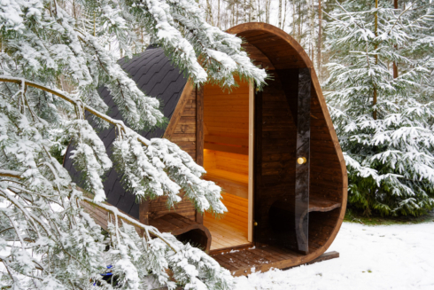 Celsium Herkus sauna surrounded by snow-covered nature