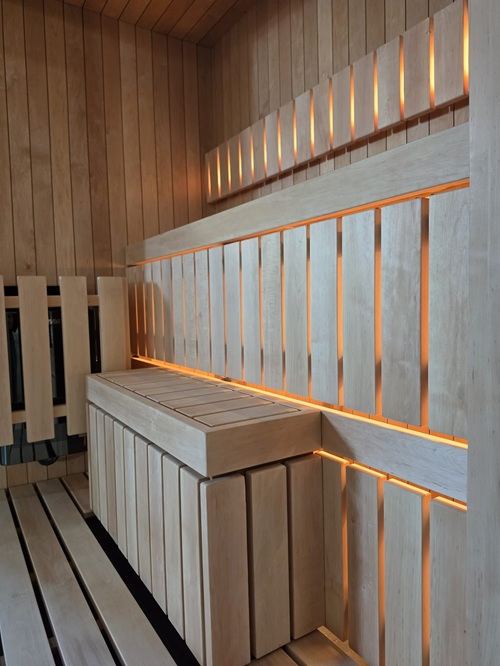 Jonas Mini interior: aspen benches with warm LED light under the backrest