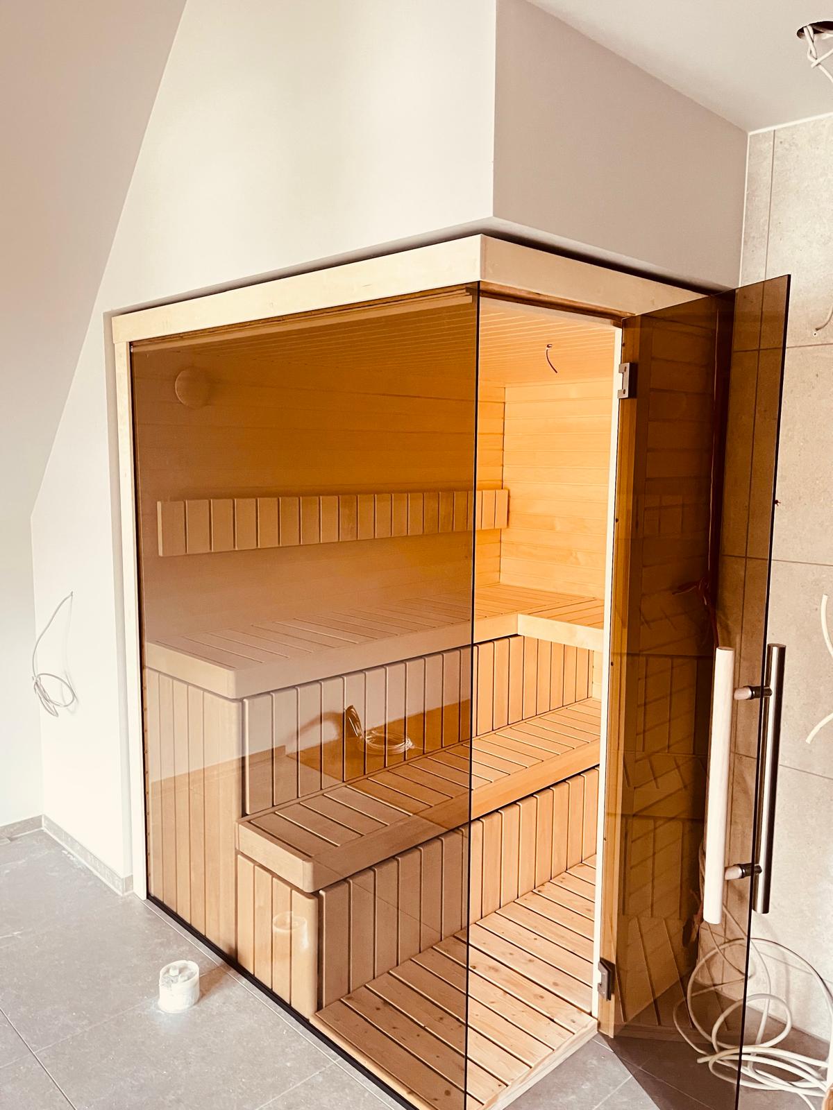 Bespoke Celsium indoor sauna with Aspen interior and smoked glass front at Design-Hotel Schutzhütte, Willingen, Germany