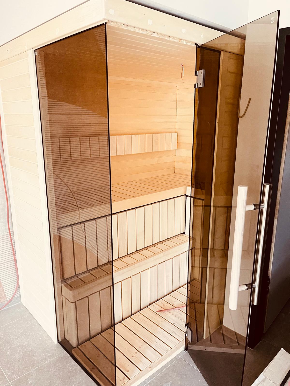 Bespoke Celsium indoor sauna with Aspen interior and smoked glass front at Design-Hotel Schutzhütte, Willingen, Germany