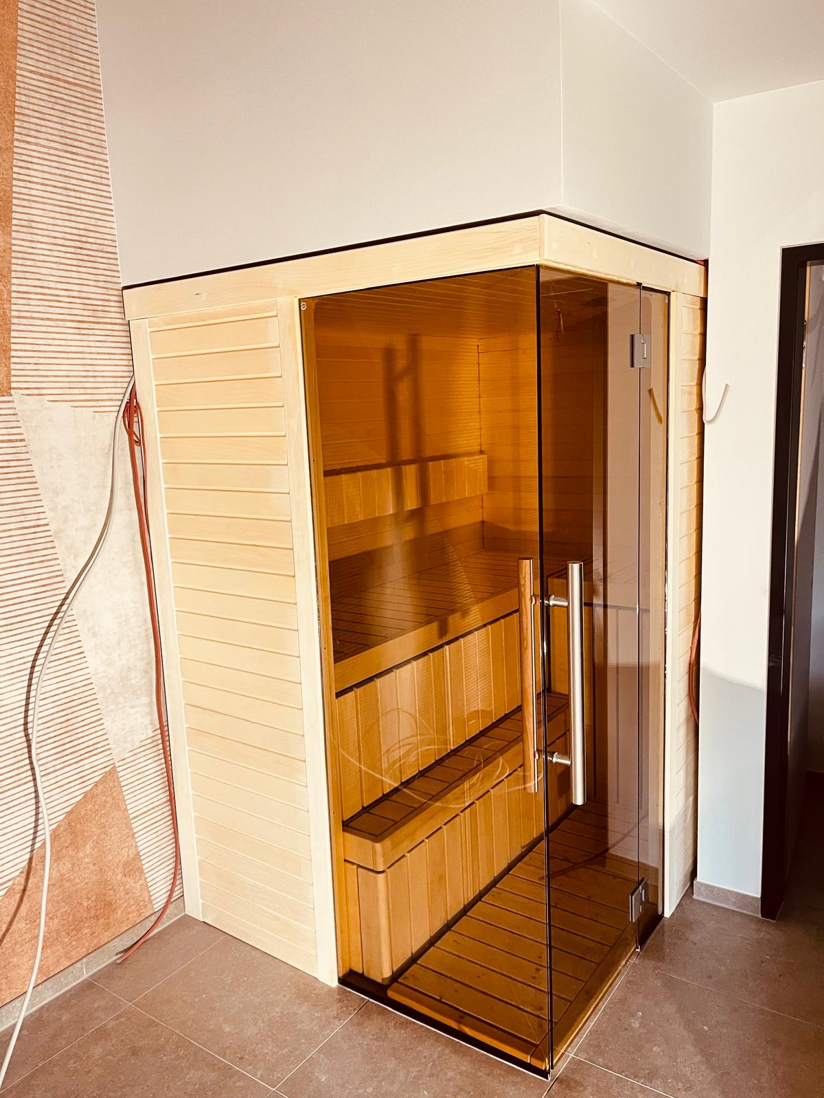 Bespoke Celsium indoor sauna with Aspen interior and smoked glass front at Design-Hotel Schutzhütte, Willingen, Germany