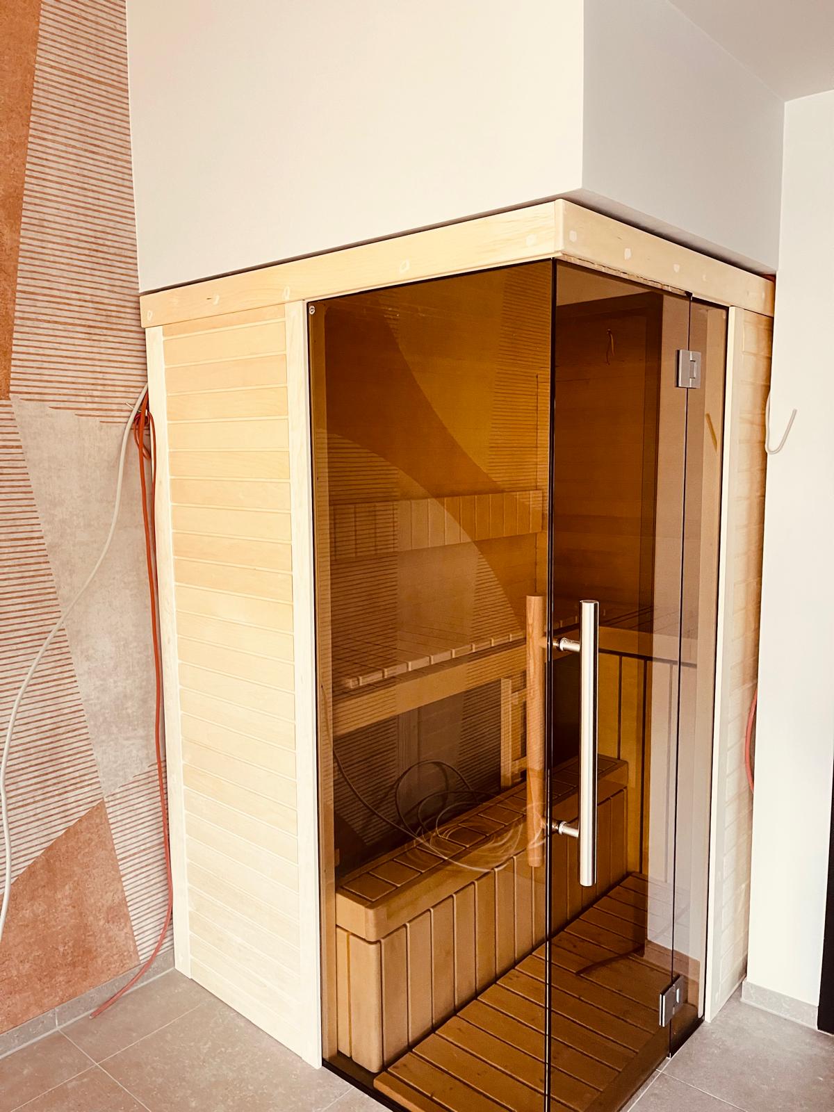 Bespoke Celsium indoor sauna with Aspen interior and smoked glass front at Design-Hotel Schutzhütte, Willingen, Germany